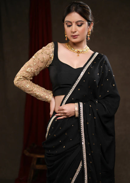 BLACK RAYON SAREE ADORNED WITH DELICATE GOLD HAND EMBROIDERY & LACE