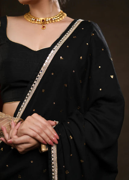 BLACK RAYON SAREE ADORNED WITH DELICATE GOLD HAND EMBROIDERY & LACE