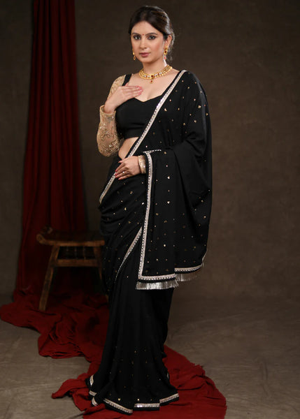 BLACK RAYON SAREE ADORNED WITH DELICATE GOLD HAND EMBROIDERY & LACE