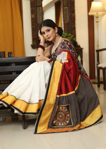 WHITE CHANDERI SAREE WITH EXCLUSIVE KALAMKARI HAND PAINTED BORDER AND MAROON PALLU WITH MIRROR WORK