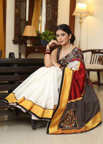 WHITE CHANDERI SAREE WITH EXCLUSIVE KALAMKARI HAND PAINTED BORDER AND MAROON PALLU WITH MIRROR WORK