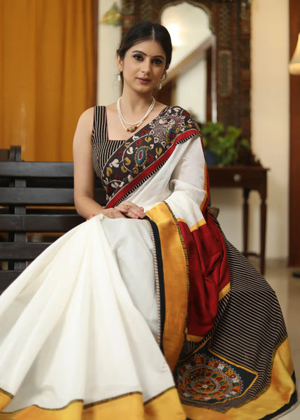 WHITE CHANDERI SAREE WITH EXCLUSIVE KALAMKARI HAND PAINTED BORDER AND MAROON PALLU WITH MIRROR WORK