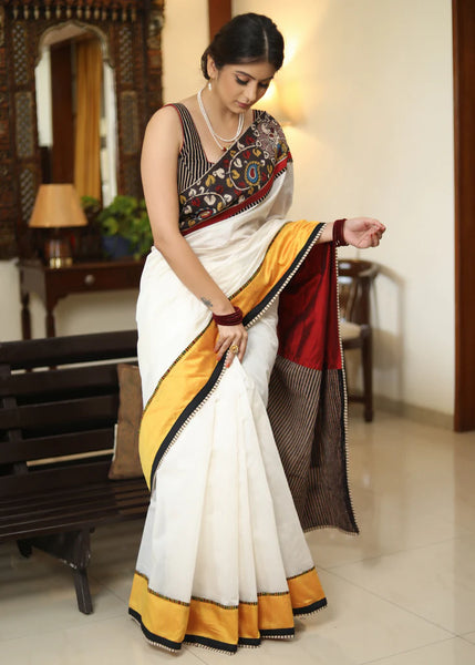 WHITE CHANDERI SAREE WITH EXCLUSIVE KALAMKARI HAND PAINTED BORDER AND MAROON PALLU WITH MIRROR WORK