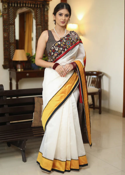 WHITE CHANDERI SAREE WITH EXCLUSIVE KALAMKARI HAND PAINTED BORDER AND MAROON PALLU WITH MIRROR WORK