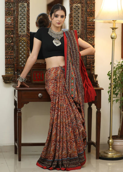 COTTON KALAMKARI PRINT SAREE WITH MIRRORWORK AND AJRAKH BORDER.