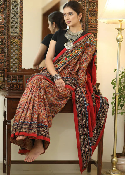 COTTON KALAMKARI PRINT SAREE WITH MIRRORWORK AND AJRAKH BORDER.