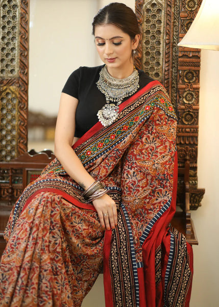 COTTON KALAMKARI PRINT SAREE WITH MIRRORWORK AND AJRAKH BORDER.