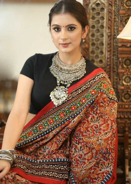 COTTON KALAMKARI PRINT SAREE WITH MIRRORWORK AND AJRAKH BORDER.