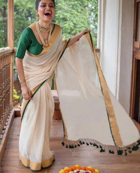 Elegant Off-white Mul Cotton Saree With Green And Gold Detailing