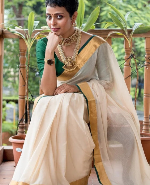 Elegant Off-white Mul Cotton Saree With Green And Gold Detailing
