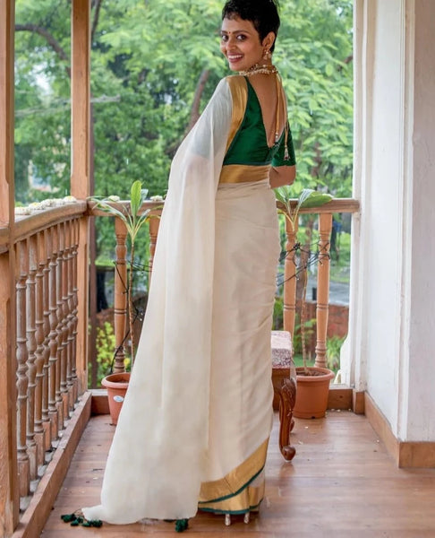 Elegant Off-white Mul Cotton Saree With Green And Gold Detailing