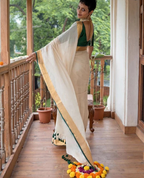 Elegant Off-white Mul Cotton Saree With Green And Gold Detailing