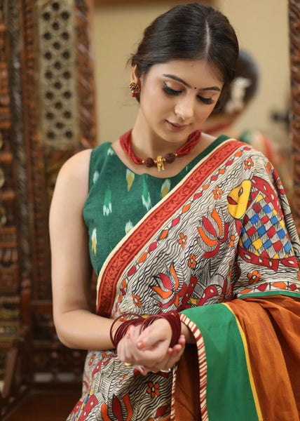 RUST COTTON SAREE WITH EXCLUSIVE HAND PAINTED MADHUBANI PALLU, LINE PLEATS & MIRROR WORK BORDER