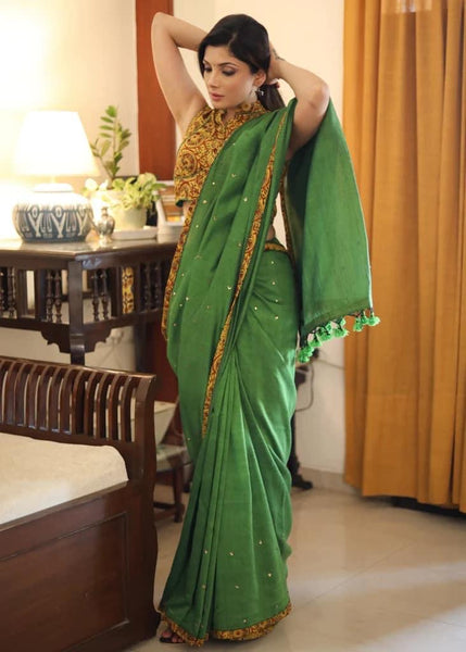 GREEN COTTON SAREE WITH YELLOW AJRAKH BORDER AND GOLDEN EMBELLISHMENT