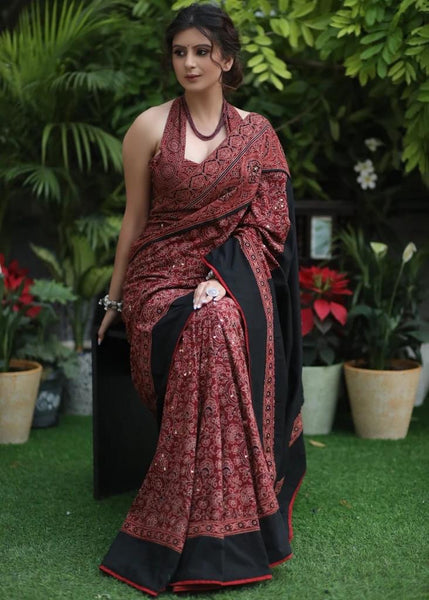 MAROON AJRAKH SAREE WITH BLACK BORDER & ACCENTUATED WITH STONE EMBELLISHMENT