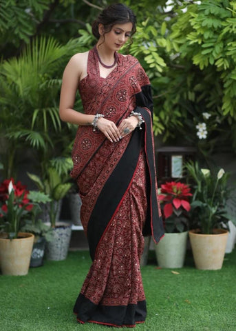 MAROON AJRAKH SAREE WITH BLACK BORDER & ACCENTUATED WITH STONE EMBELLISHMENT