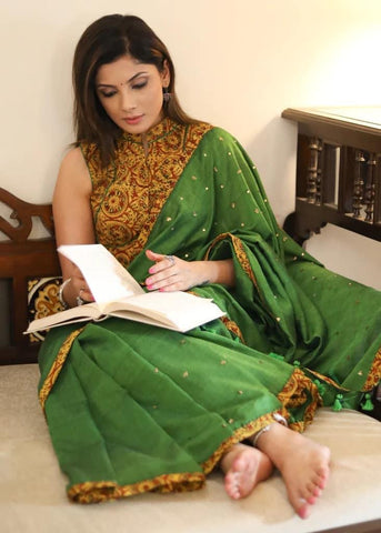 GREEN COTTON SAREE WITH YELLOW AJRAKH BORDER AND GOLDEN EMBELLISHMENT