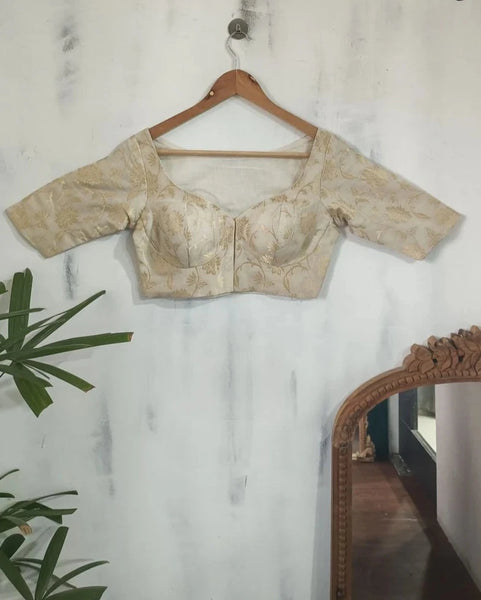 Readymade Off White Silk Elbow Sleeves Blouse With Floral Design