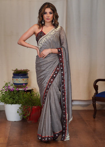 GREY CHIFFON SAREE WITH ELEGANT MOTI WORK AND EXCLUSIVE AJRAKH BORDER WITH MIRROR WORK