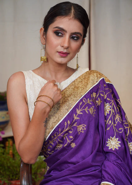 PURPLE ASSAM SILK SAREE WITH DELICATE EMBROIDERY AND GOLDEN BANARASI BORDER