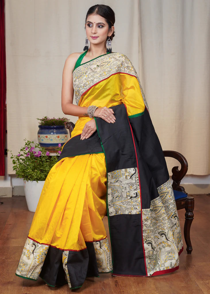 YELLOW CHANDERI SAREE WITH THE COMBINATION OF MADHUBANI PRINT AND BLACK COTTON SILK BORDER