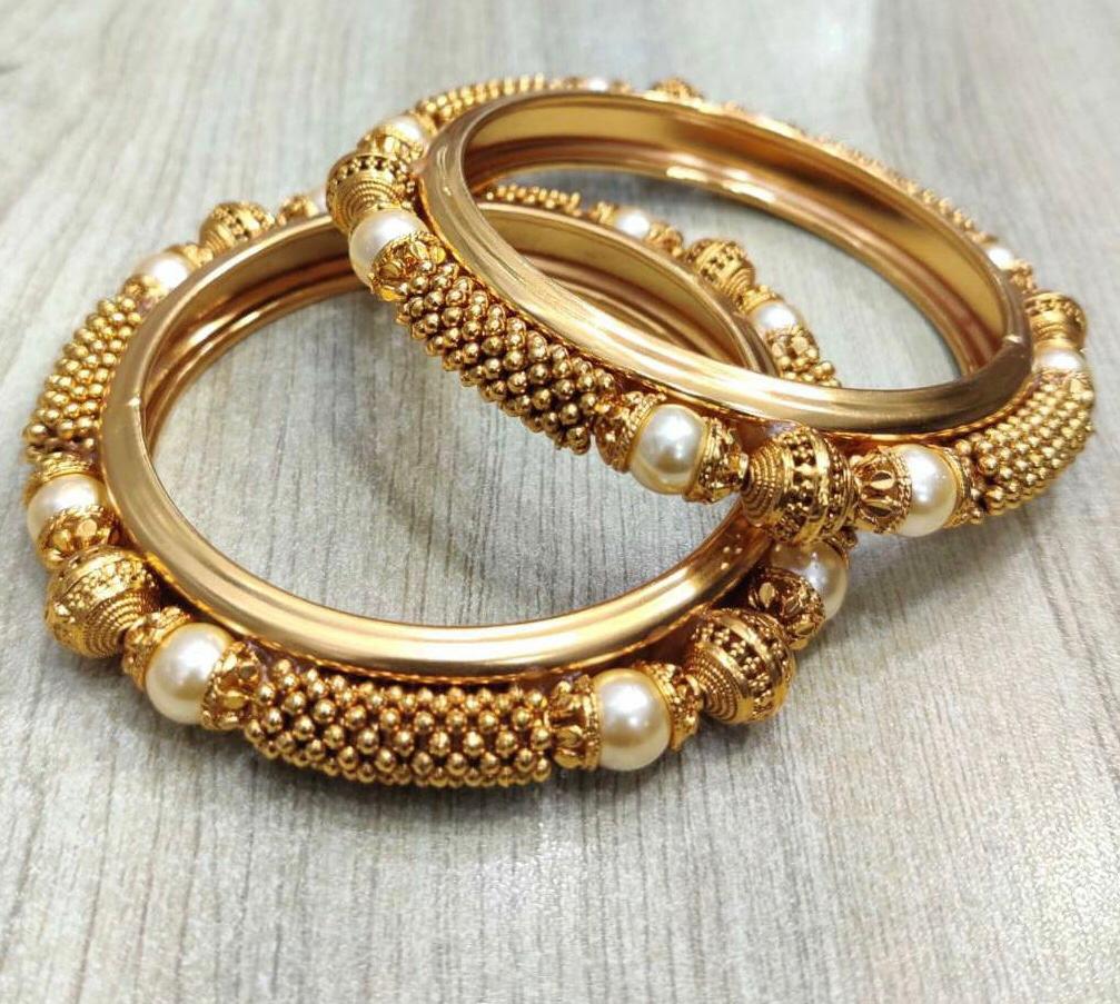 Gold Colored Bangles with White Pearls