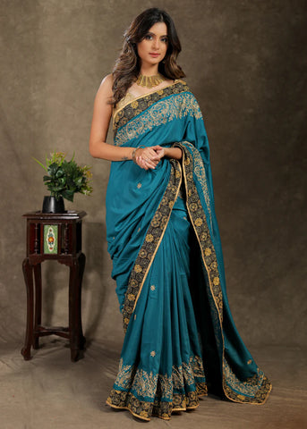 Embroidered Teal Blue Rayon Saree With Ajrakh Border