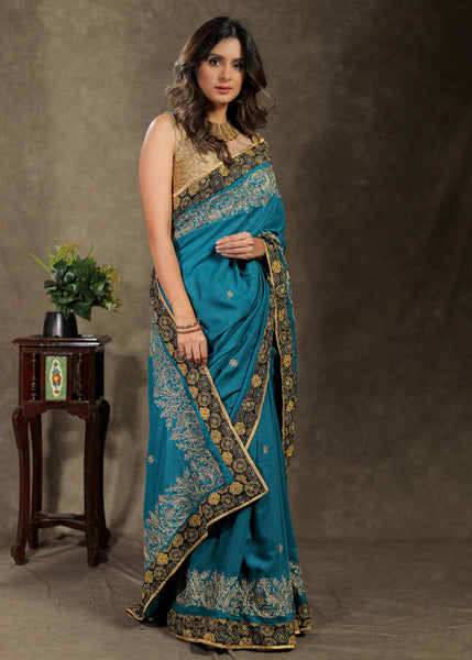 Embroidered Teal Blue Rayon Saree With Ajrakh Border