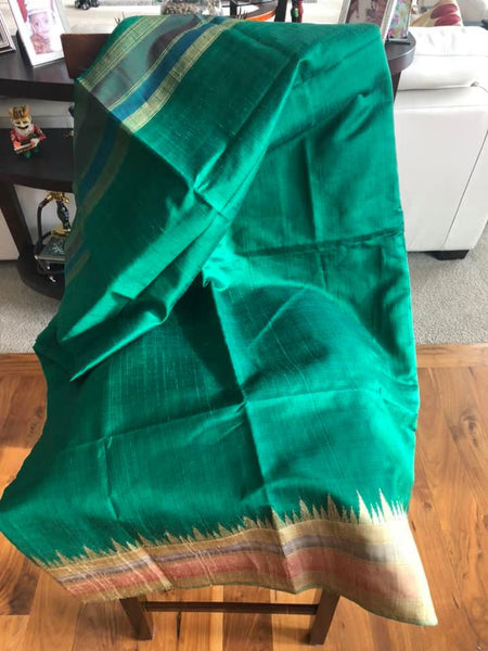 Pure Tussar Dupion Silk in Deep Green with Golden Multicolored Matte Temple Border with Golden Aachal with Tassels