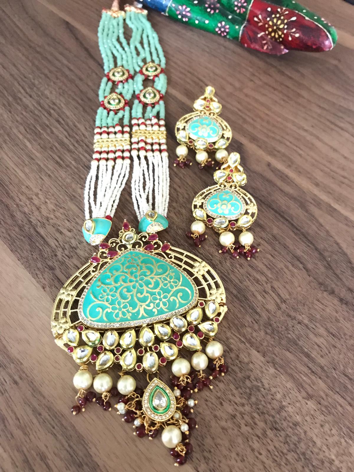 Sky Blue Garnet Kundan Necklace Set with Stonework with Matching Earrings