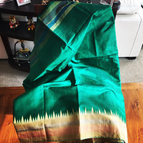 Pure Tussar Dupion Silk in Deep Green with Golden Multicolored Matte Temple Border with Golden Aachal with Tassels