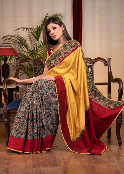 MUSTARD SEMI SILK SAREE WITH PRINTED AJRAKH PLEATS & MIRROR WORK BORDER