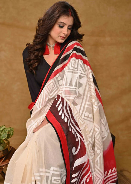 CREAM COTTON SAREE WITH BEAUTIFUL RED AND BLACK ALPANA PAINTING