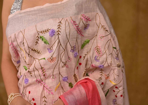 PINK LINEN SAREE WITH HAND EMBROIDERY AND ZARI BORDER