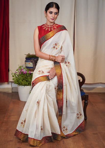 WHITE CHANDERI SAREE WITH FLORAL MACHINE EMBROIDERY AND IKAT BORDER