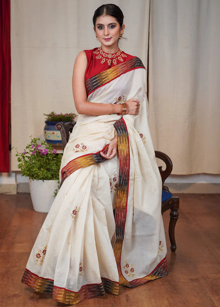 WHITE CHANDERI SAREE WITH FLORAL MACHINE EMBROIDERY AND IKAT BORDER