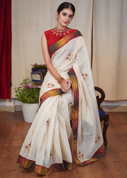 WHITE CHANDERI SAREE WITH FLORAL MACHINE EMBROIDERY AND IKAT BORDER